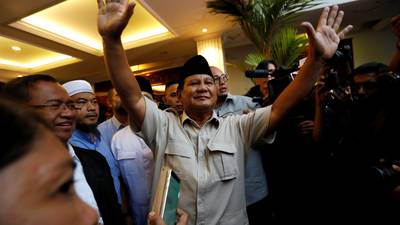 Indonesia’s police warn against rallies as opposition claims election win
