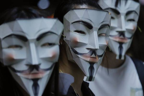 Hong Kong protesters mock Chinese leader in defiance of masks ban