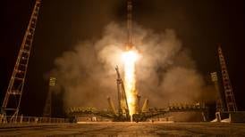 Russian crew reaches space station for year-long stay