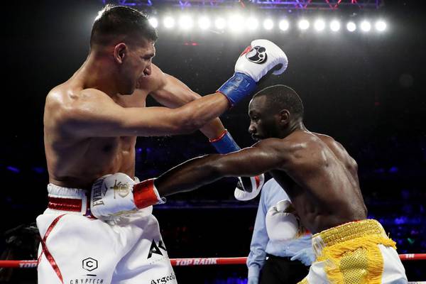 Terence Crawford stops Amir Khan in sixth round after low blow