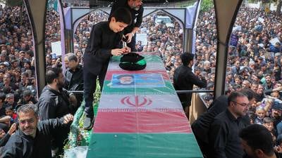 Iran buries president Ebrahim Raisi and others killed in helicopter crash at holy shrine