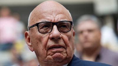 Rupert Murdoch gives up bonus as News Corp posts $1bn loss