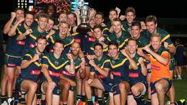 Tom Meagher presents winning trophy to Australia in Perth