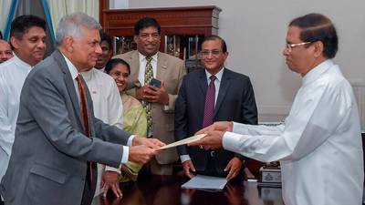 Sri Lankan president re-appoints PM he sacked two months ago