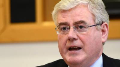 Eamon Gilmore  reacts angrily to  Micheál Martin’s comments on bank guarantee