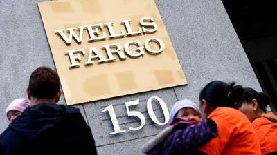 Scandal-hit Wells Fargo sees fourth straight quarter fall