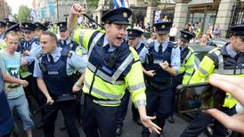 Female garda knocked out  at Dáil water charges protest