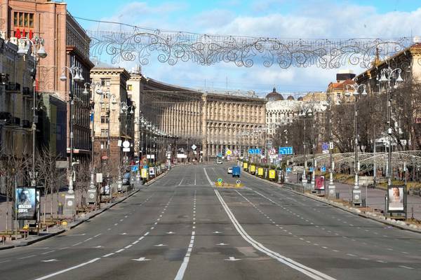 ‘This is our place’: besieged Kyiv prepares to fight as Russian troops reach outskirts