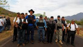 Mexico urges vigilantes to stand down in drugs gang conflict