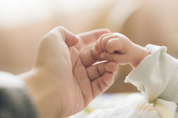 Parents united with baby born through surrogacy thank Ukrainian people