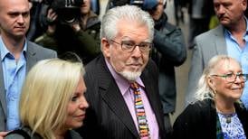 Rolf Harris assaulted girl while parents downstairs, court hears