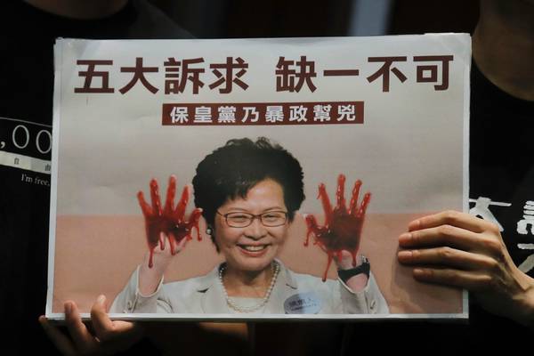 Hong Kong’s leader aborts annual policy speech amid protests